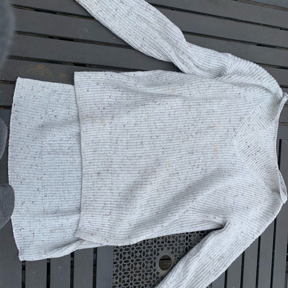 White sweater with a slit on both sides